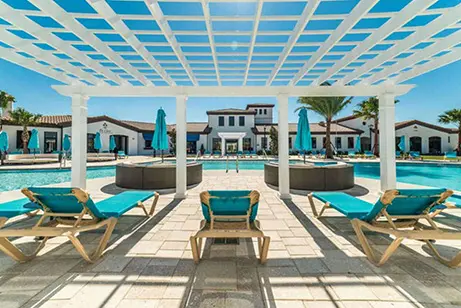 Pool, hot tubs and lounging chairs at Casago Vacation Rentals